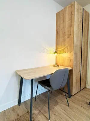 a wooden desk with a chair and a lamp at Chic Studio Haven by Century City - FH2 - BV in Los Angeles