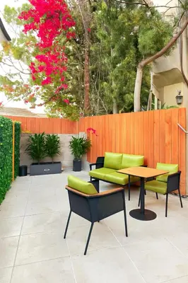 a patio with a table and chairs and a fence at Chic Studio Haven by Century City - FH2 - BV in Los Angeles