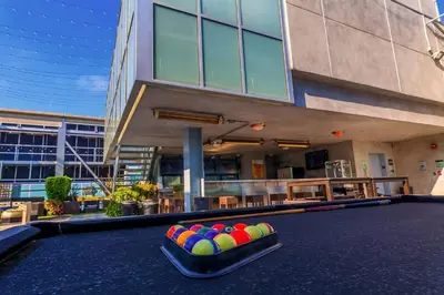 a pool table with balls in front of a building at Sleek 1BR Loft in Luxury High-Rise - 103 - GL in Glendale