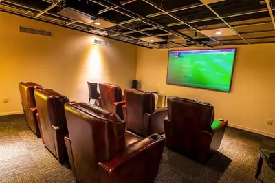 a room with leather chairs and a flat screen tv at Luxury Loft Living 1BR in Trendy Complex -113-GL in Glendale