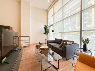 a living room with a couch and a table at Luxury Loft Living 1BR in Trendy Complex -113-GL in Glendale
