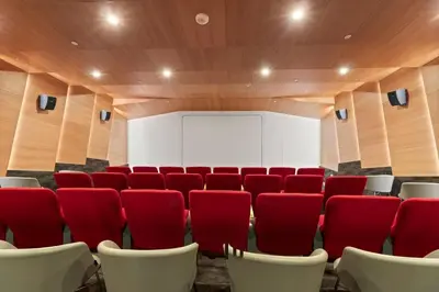 a conference room with red chairs and a white screen at Luxury Loft Living 1BR in Trendy Complex -113-GL in Glendale