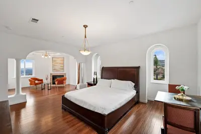 a bedroom with a bed and a living room at Mountain View Luxury Estate with Pool in West Hills in Chatsworth Lake Manor