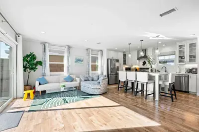 a living room with a kitchen and a dining room at Charming Modern Escape with Outdoor Living in San Dimas