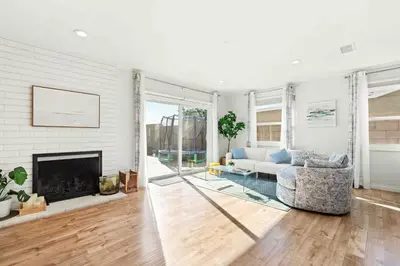 a living room with a couch and a fireplace at Charming Modern Escape with Outdoor Living in San Dimas