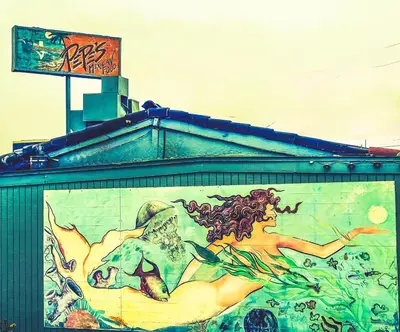 a painting of a woman on the side of a building at Silverstrand Beach House in Oxnard