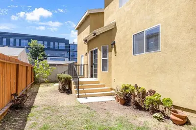 a house with stairs next to a building at Spacious Culver City 4BR - Half Block from Amazon in Los Angeles