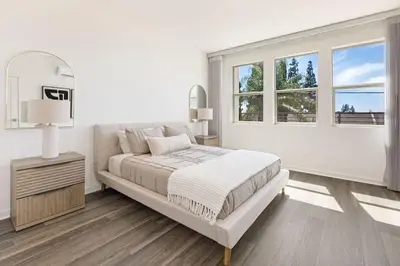 a white bedroom with a bed and a window at Modern Townhouse Near Disneyland & OC Beaches in Covina