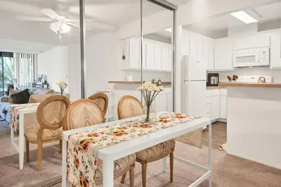a kitchen and dining room with a table and chairs at Lux Marina Village with parking in Los Angeles