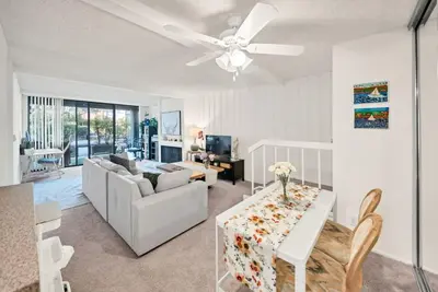 a living room with a couch and a table at Lux Marina Village with parking in Los Angeles