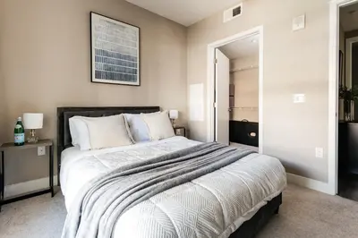 a bedroom with a large bed in a room at Elegant 2BD WeHo Apartment in Los Angeles