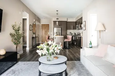 a living room with a white couch and a table at Elegant 2BD WeHo Apartment in Los Angeles