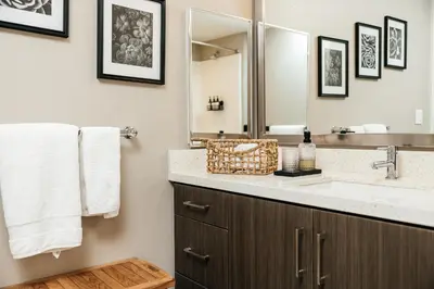 a bathroom with a sink and a mirror at Elegant 2BD WeHo Apartment in Los Angeles