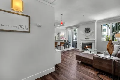 a living room with a couch and a fireplace at Heart of La, Walk to everything!! in Los Angeles