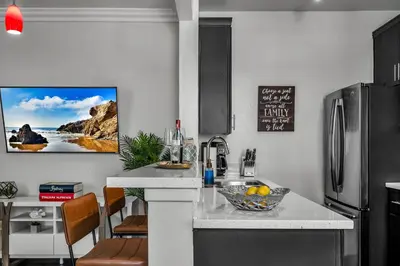 a kitchen with a counter with a bowl of fruit on it at Heart of La, Walk to everything!! in Los Angeles