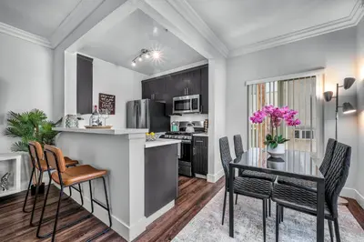 a kitchen and dining room with a table and chairs at Heart of La, Walk to everything!! in Los Angeles