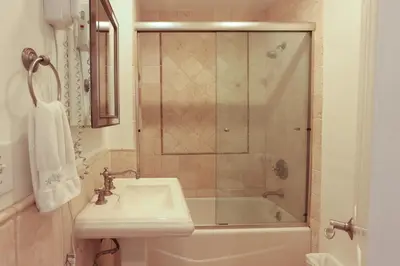 a bathroom with a shower and a sink and a tub at SM ocean view in Los Angeles