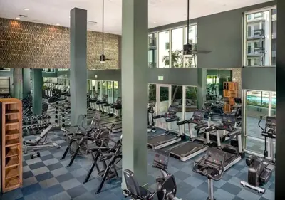 a gym with a lot of treadmills and ellipticals at New Oasis Near Disneyland Pool Gym Free Parking in Santa Ana