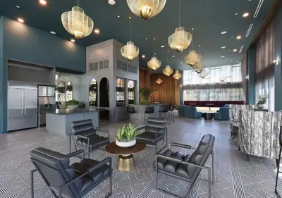 a lobby with chairs and a bar in a building at Charming 2BR Retreat Pool Gym 10min to Disneyland in Santa Ana
