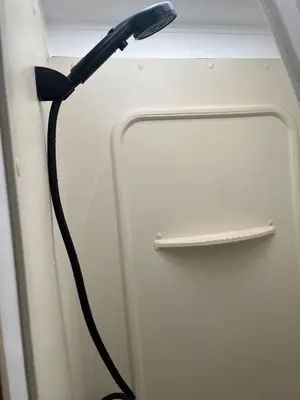 a black object is attached to a door at Comfortable Guest RV With EV charger Semi Rural Area in Bodfish