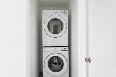 a washer and a washing machine in a room at Prestige 5BR Townhome Near LA Hot Spots in Los Angeles