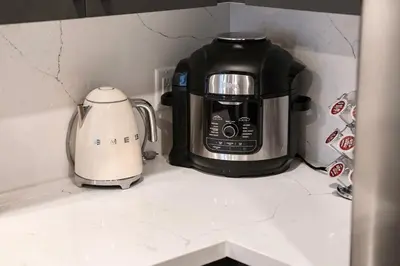 a coffee maker and a toaster sitting on a counter at Elevated Escape Luxury 1BR in Hollywood in Los Angeles