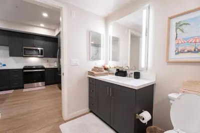 a small kitchen with a sink and a toilet at Elevated Escape Luxury 1BR in Hollywood in Los Angeles