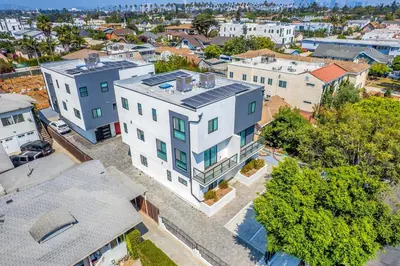 an overhead view of a large white building in a city at 3BR Urban Retreat with Modern Amenities in Los Angeles