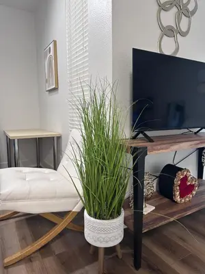a living room with a white couch and a tv at Marina del Rey 1BR apt Ocean Walk, Pool, Hot Tub, Gym, BBQ, Lagoon, Sunset Views in Los Angeles