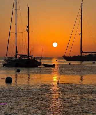 two sailboats in the water at sunset at Marina del Rey 1BR apt Ocean Walk, Pool, Hot Tub, Gym, BBQ, Lagoon, Sunset Views in Los Angeles