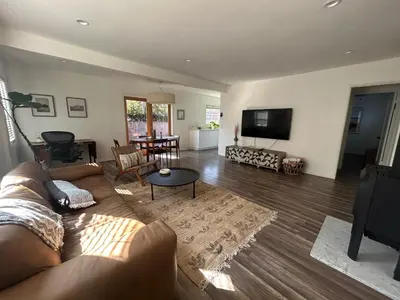 a living room with a couch and a table at West LA Gem Comfort and Convenience in Los Angeles