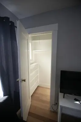 a small room with a door and a television in it at Cozy room in East Holywood, 7 min from holllywood, 15 from downtown, 20 to hollywood sing in Los Angeles