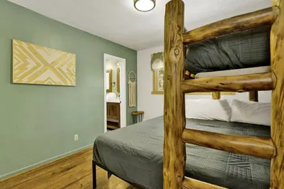 a bedroom with two bunk beds in a room at Arlberg Village Haus Game Room Walk to the Slopes in Big Bear Lake