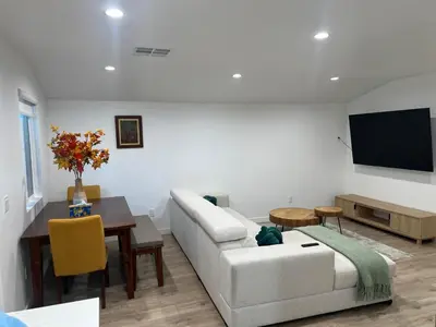 a living room with a couch and a tv at Hanna's Corner in Canoga Park