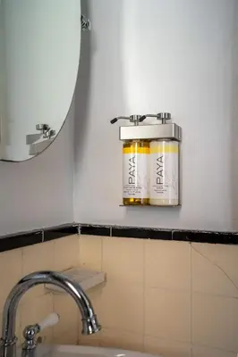 a jar of honey on a shelf above a sink at Modern Bachelor in Hollywood in Los Angeles