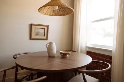 a dining room table with a vase on top of it at The Hollywood Sign Lookout in Los Angeles