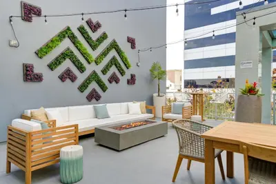 a living room with a couch and a table at WEHO Place By Sunset Plaza in Los Angeles