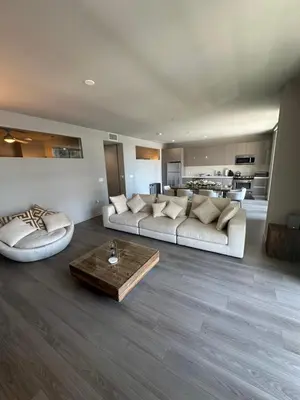 a large living room with a couch and a table at Luxury 2BR Apt with balcony!! in Los Angeles