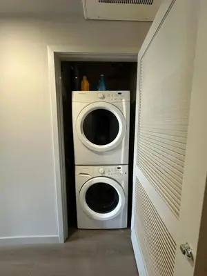 a laundry room with a washer and dryer at Luxury 2BR Apt with balcony!! in Los Angeles