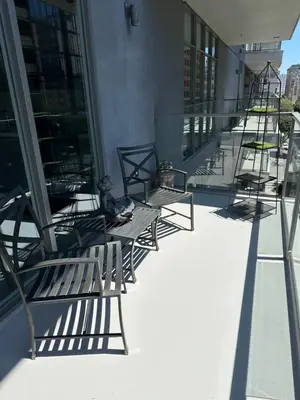 a row of benches sitting on the side of a building at Luxury 2BR Apt with balcony!! in Los Angeles