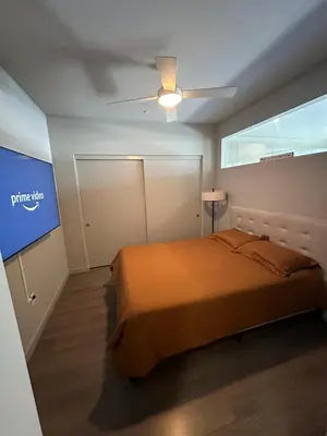 a bedroom with a bed and a ceiling fan at Luxury 2BR Apt with balcony!! in Los Angeles