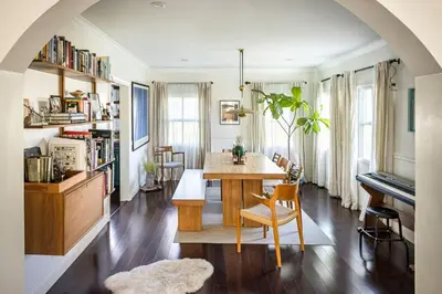 a dining room with a table and a piano at The Whitley Heights Sweet Escape With Jacuzzi and parking in Los Angeles