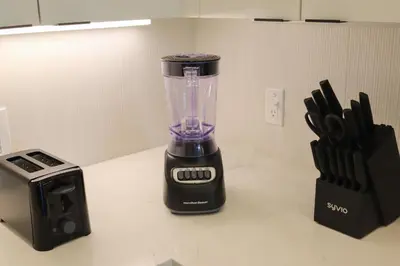 a blender sitting on a counter next to a toaster at Bright & Cozy Getaway with Pool Free Parking 10 mins Disneyland in Santa Ana