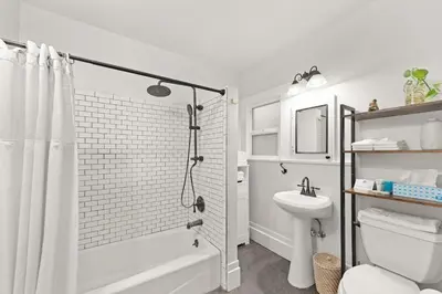 a bathroom with a shower and a toilet and a sink at Sea View, Sauna, Hot Tub, Beach Bikes, Stream in Ventura