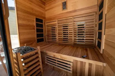 a sauna with wooden walls and wooden floors at Ocean View, Hot Tub, Sauna, Beach Bikes in Ventura
