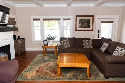 a living room with a couch and a coffee table at Historic craftsman sleeps 9 3br2.5ba Disney 1mi in Anaheim