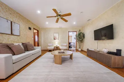 a living room with a couch and a tv at Santa Monica 2BD Home - 20 mins to LAX Airport! in Los Angeles