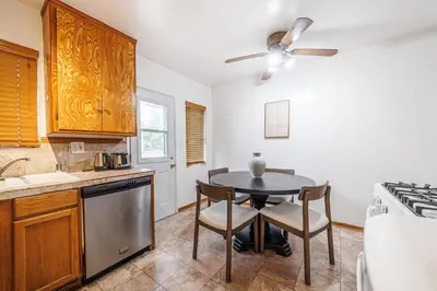 a kitchen with a table and chairs and a stove at Santa Monica 2BD Home - 20 mins to LAX Airport! in Los Angeles