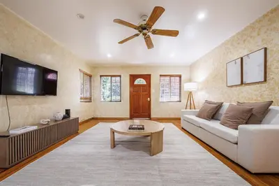a living room with a couch and a ceiling fan at Santa Monica 2BD Home - 20 mins to LAX Airport! in Los Angeles