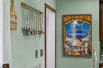 a picture hanging on a wall next to a door at Imagination Kingdom by OC Adventure Homes in Garden Grove